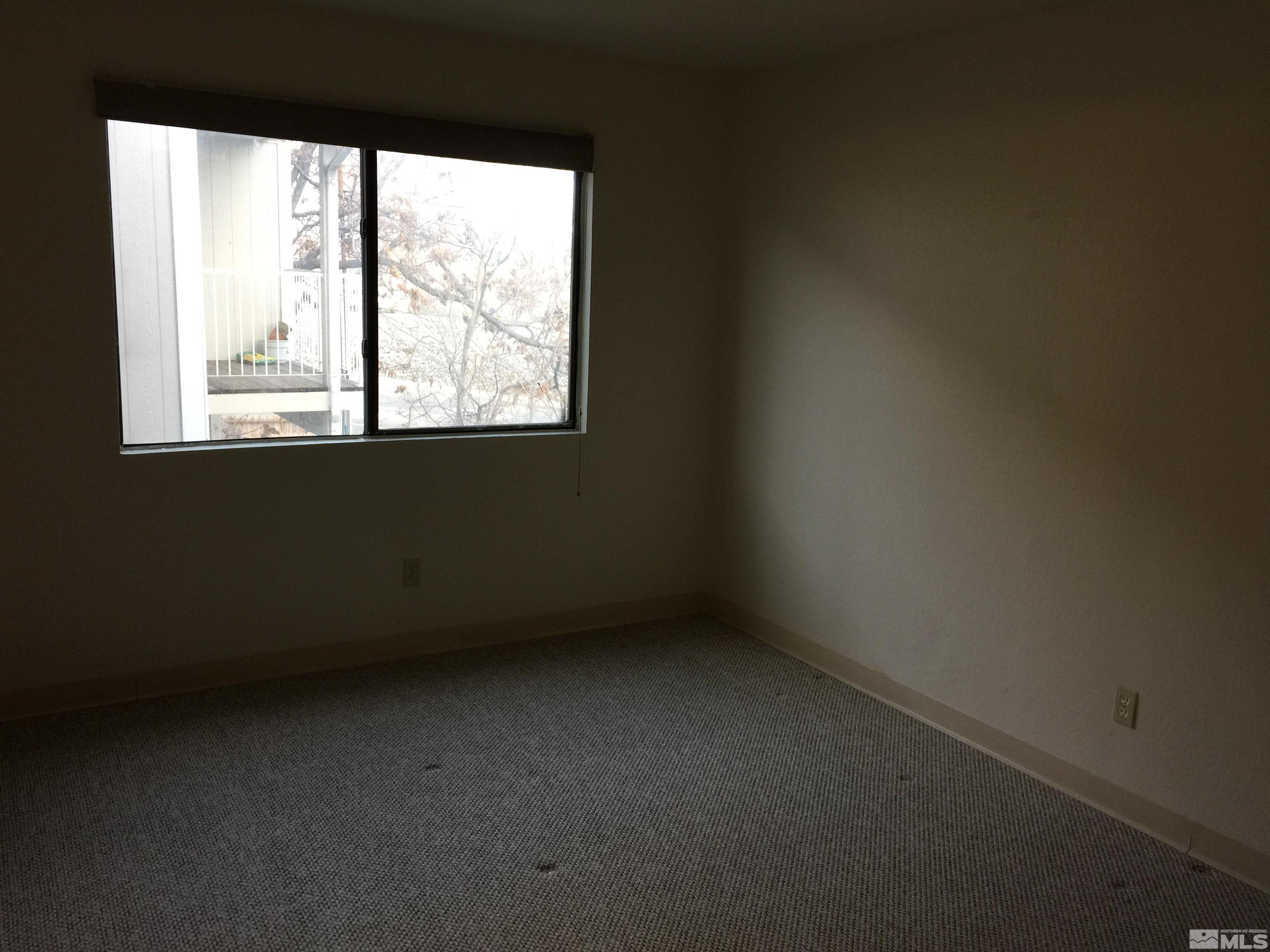 490 Highland Avenue, Unit 9 Reno, NV 89512 - Photo 3 of 3 an empty room with a window