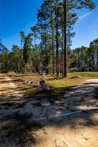 a view of a swimming pool with an outdoor space and seating area