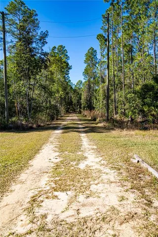 a view of a swimming pool with an outdoor space and seating area
