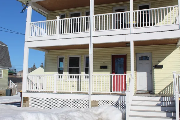 a view of a house with a fence and a gate