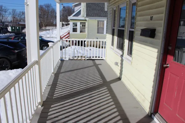 a view of a house with wooden deck