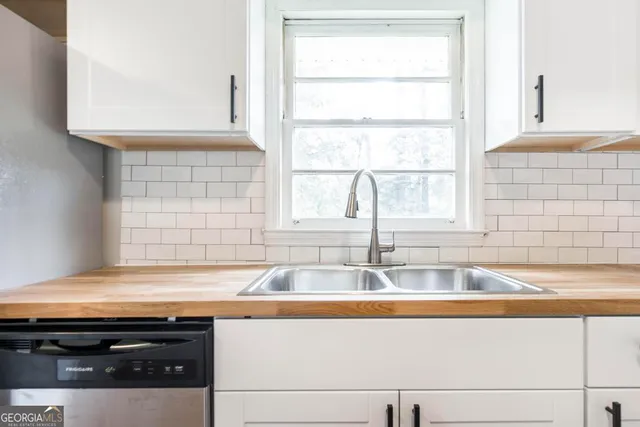 a kitchen with a sink and a window