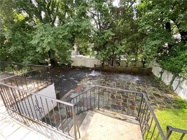 a view of a lake with swimming pool and sitting area