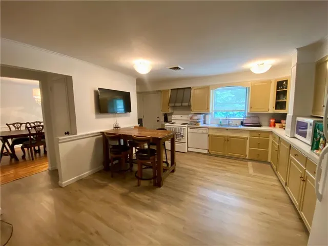 a kitchen with a sink cabinets and counter top space