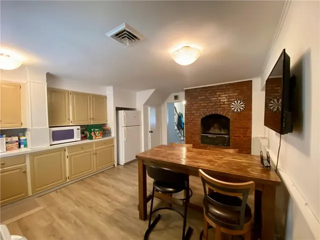 a kitchen with a table and chairs