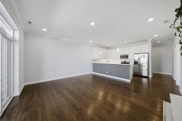 a kitchen with stainless steel appliances a refrigerator and a sink
