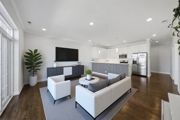 a kitchen with a refrigerator sink and cabinets