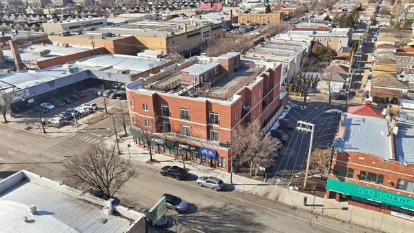 an aerial view of multi story residential apartment building