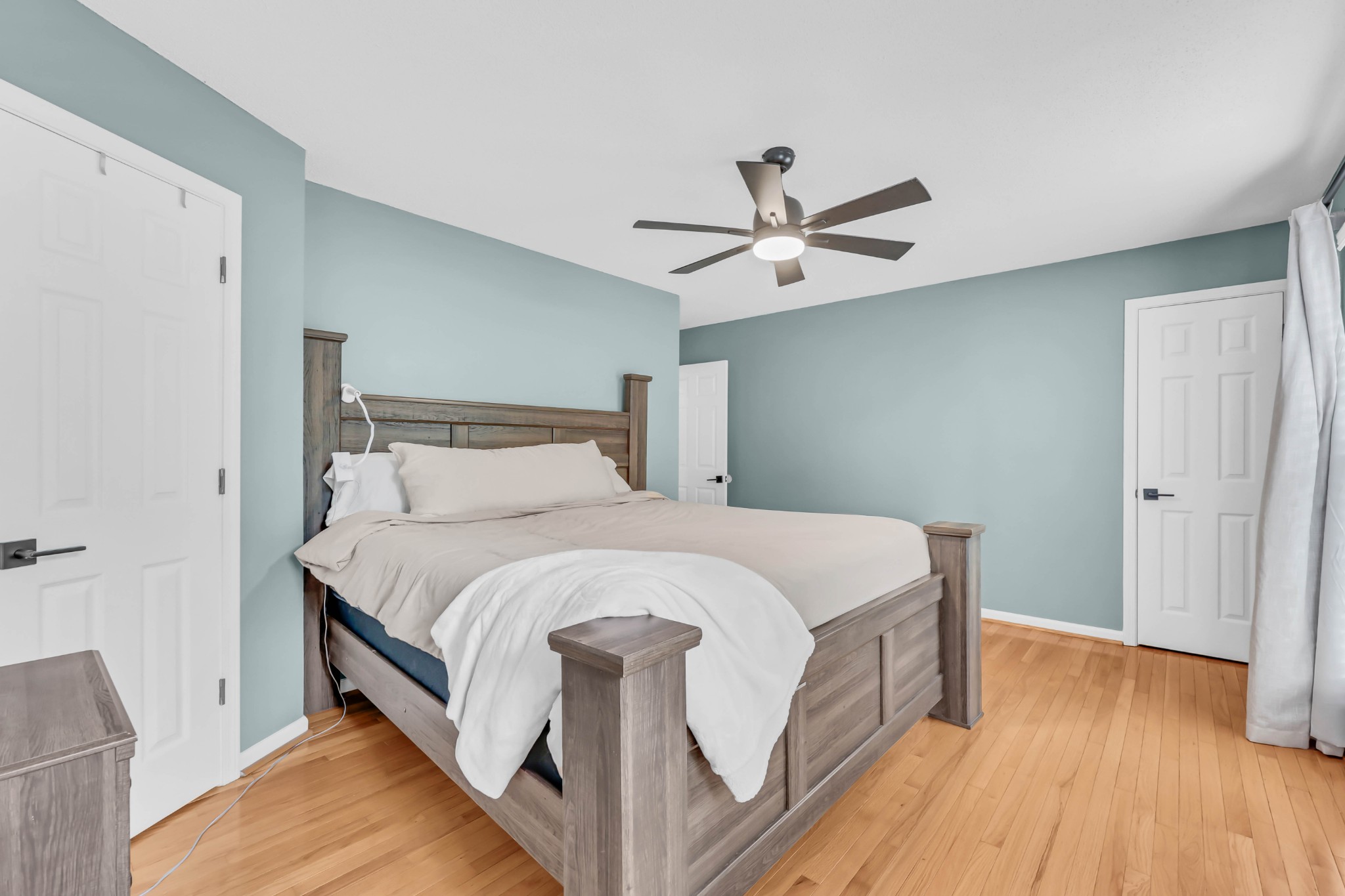 3300 Backridge Road Woodlawn, TN 37191 - Photo 23 of 42 a spacious bedroom with a bed and wooden floor