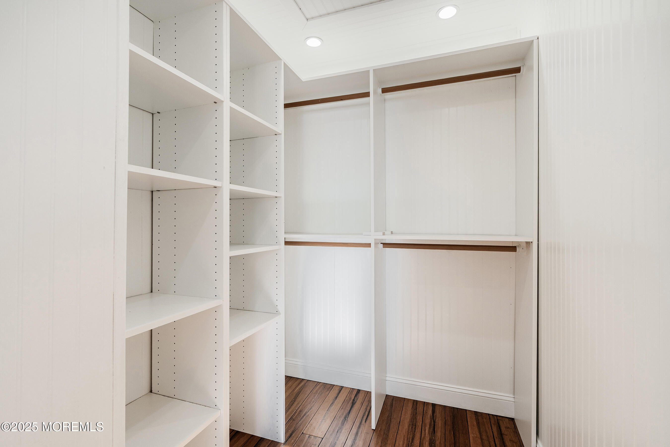 7 Longfellow Court Freehold, NJ 07728 - Photo 22 of 38 a view of walk in closet with empty racks