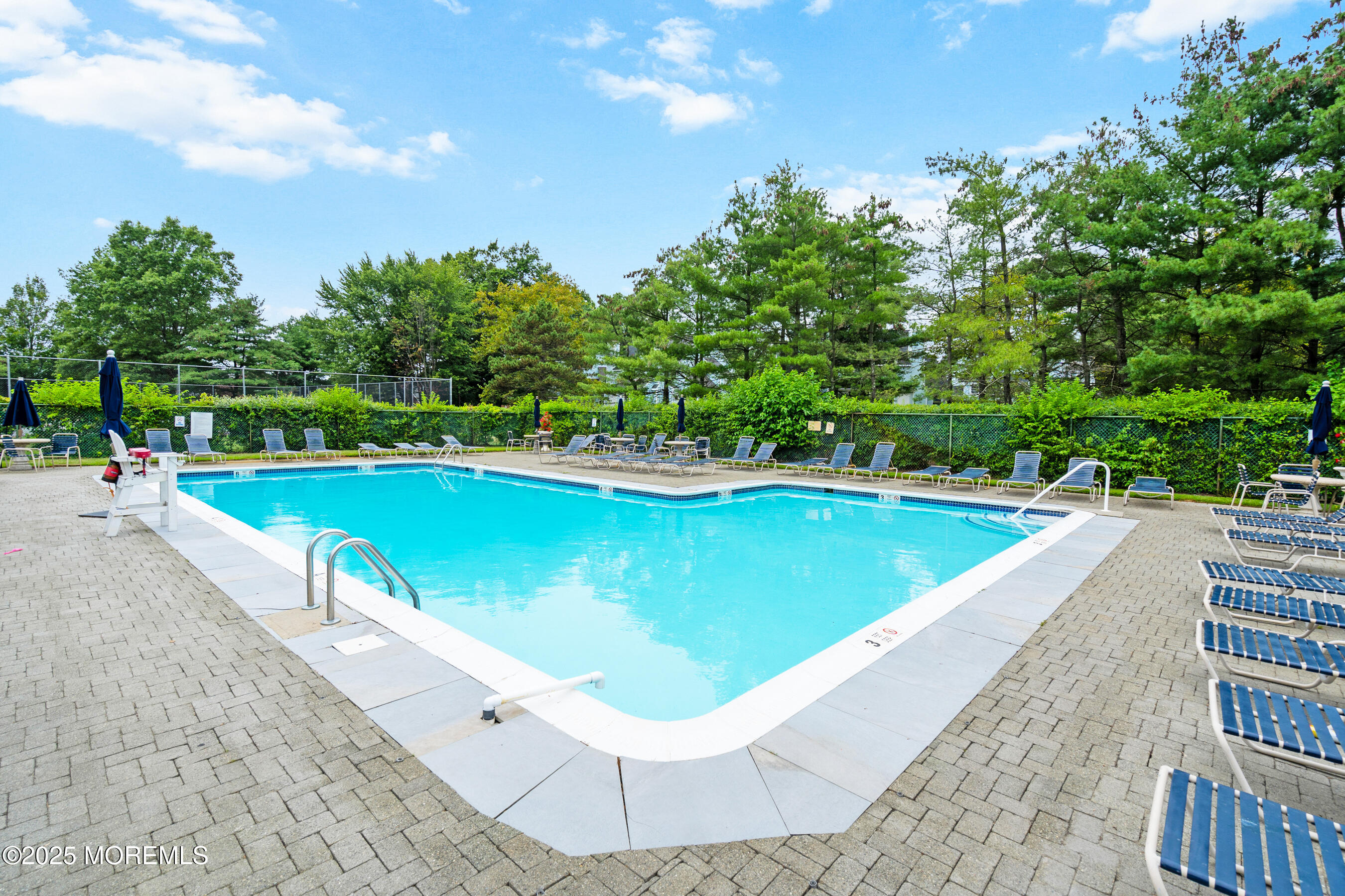 7 Longfellow Court Freehold, NJ 07728 - Photo 36 of 38 a view of a swimming pool with a garden and trees