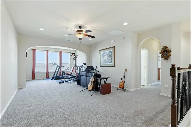 a bathroom with a tub a sink a mirror and a shower