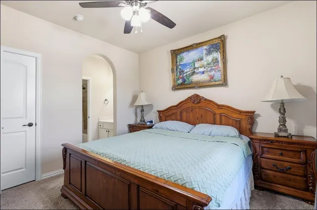 a view of a hallway with entryway and stairs