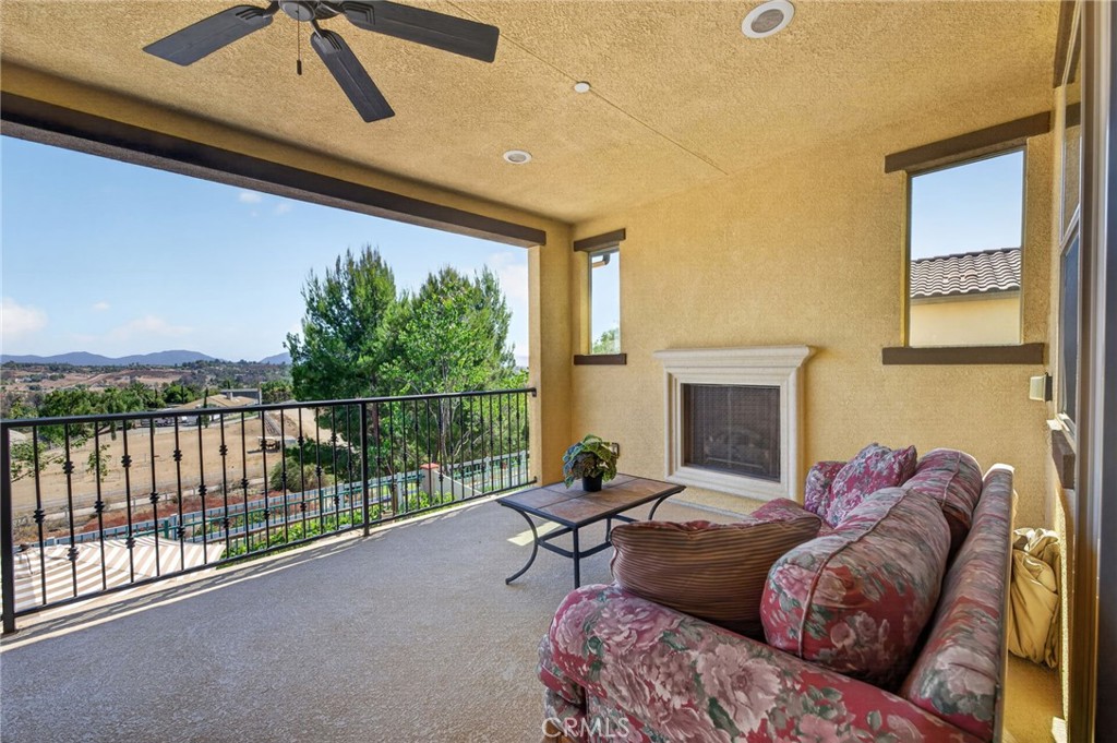 31749 Country View Road Temecula, CA 92591 - Photo 40 of 68 a living room with furniture and a fireplace