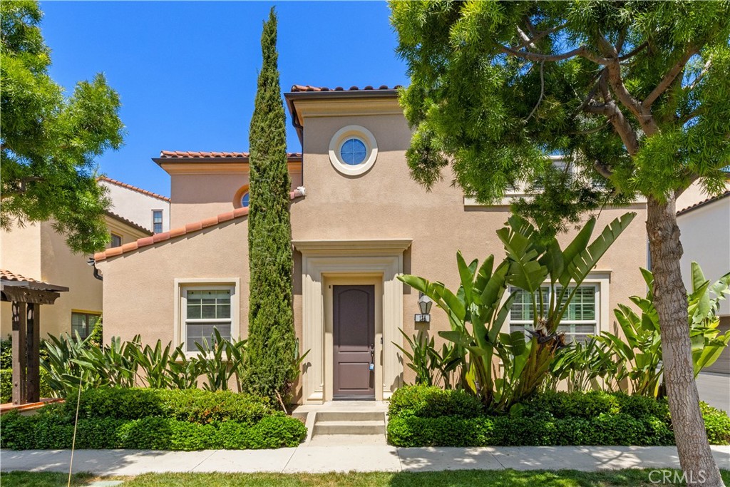 front view of a house with a tree