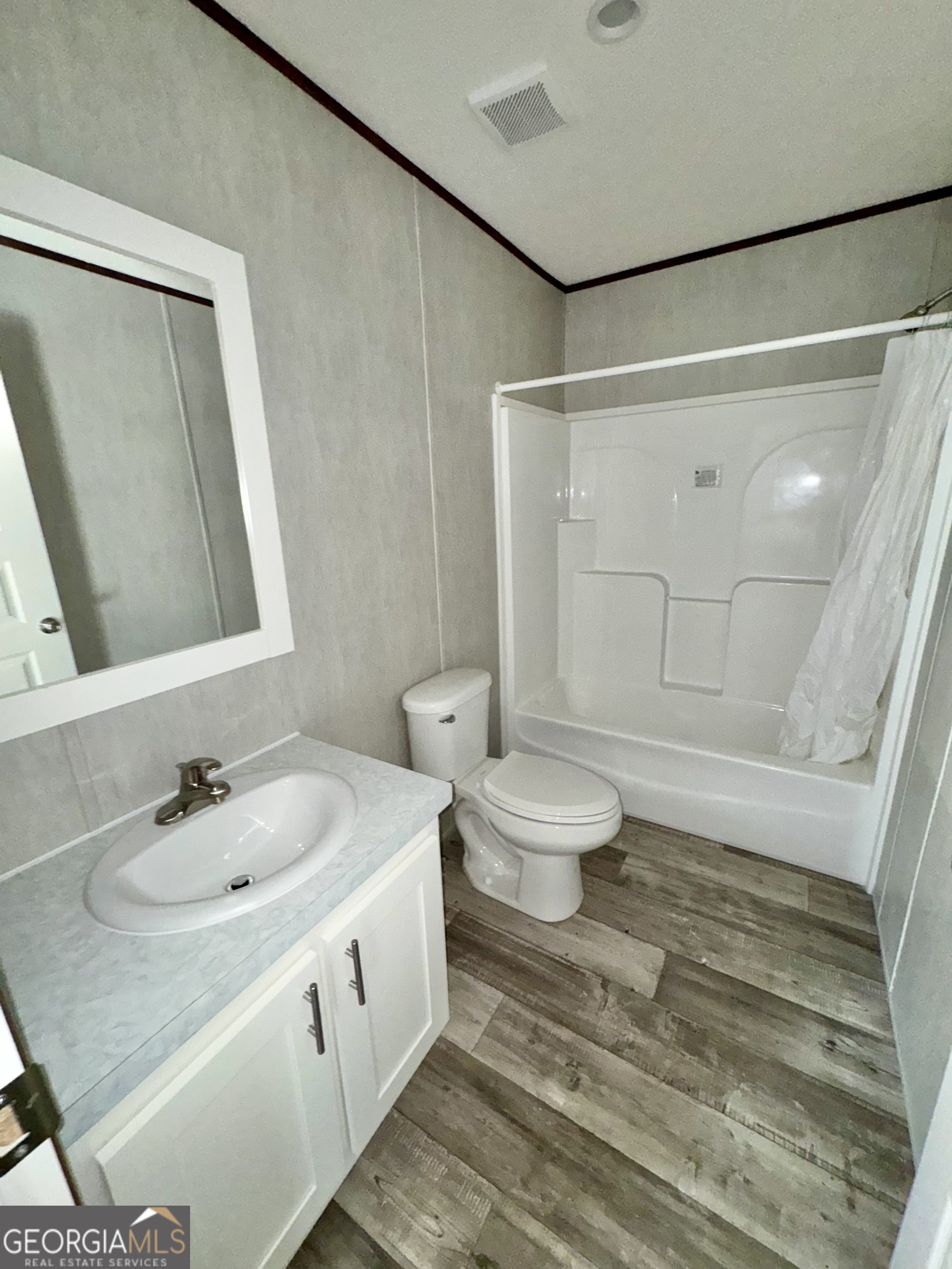 589 Ben Jackson Road Vidalia, GA 30474 - Photo 16 of 17 a bathroom with a sink and a mirror