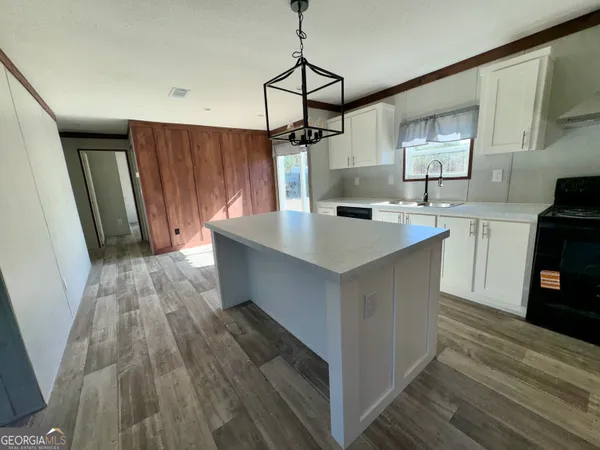 a view of living room with furniture and fireplace