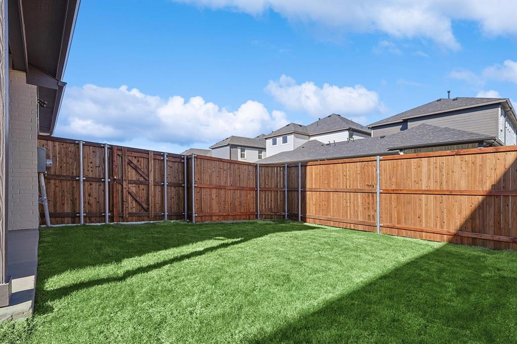 11458 Chartwell Court Frisco, TX 75035 - Photo 32 of 32 a view of a backyard with wooden fence