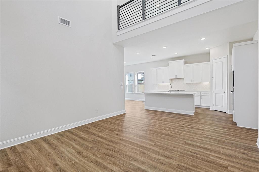 11458 Chartwell Court Frisco, TX 75035 - Photo 8 of 32 a view of kitchen view with wooden floor and cabinets