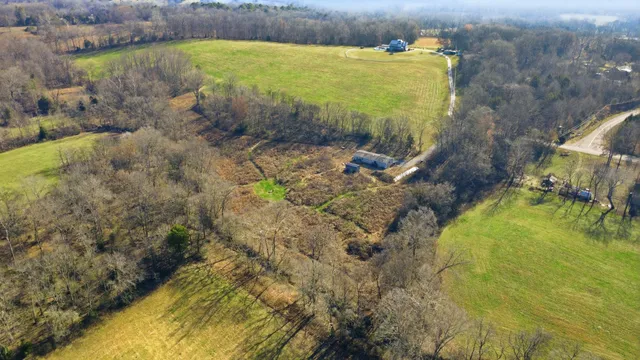 a bathroom with a double vanity sink a mirror and a bathtub