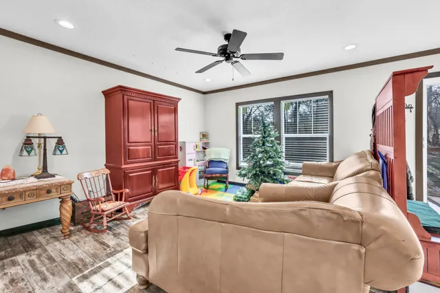 a living room with furniture and a fireplace