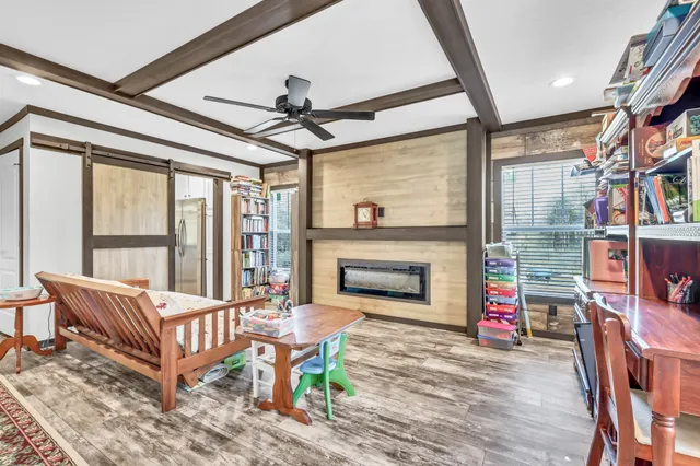 a bedroom with furniture and a window