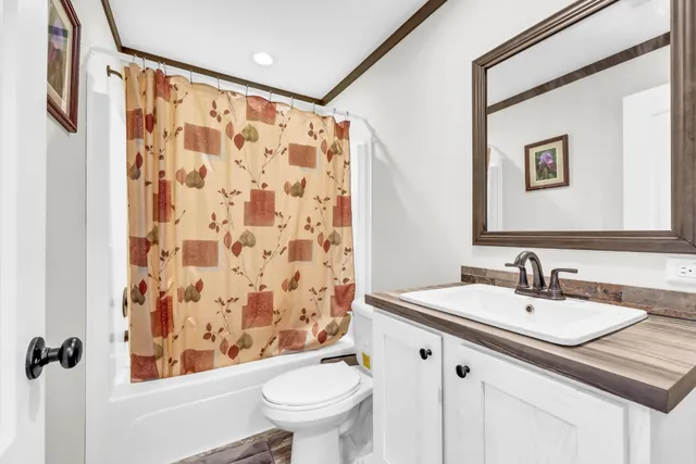 a bathroom with a toilet and a sink