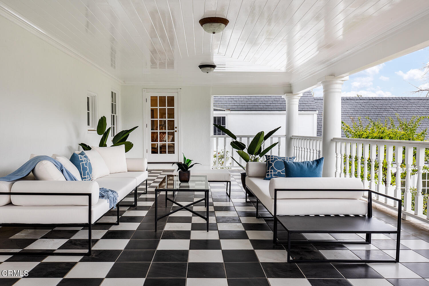 3001 Lombardy Road Pasadena, CA 91107 - Photo 35 of 74 a living room with a black white checkered floor with a gaming machine and wooden floor