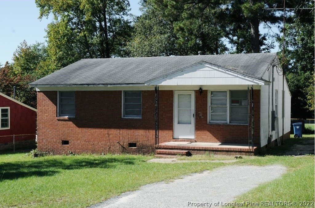 809 Isley Street Fayetteville, NC 28305 - Photo 1 of 2 a front view of a house with a yard and garage