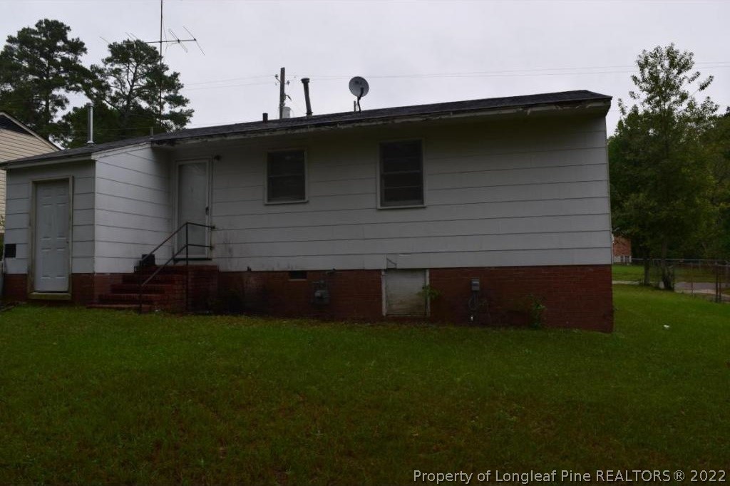 809 Isley Street Fayetteville, NC 28305 - Photo 2 of 2 a backyard of a house with lots of green space