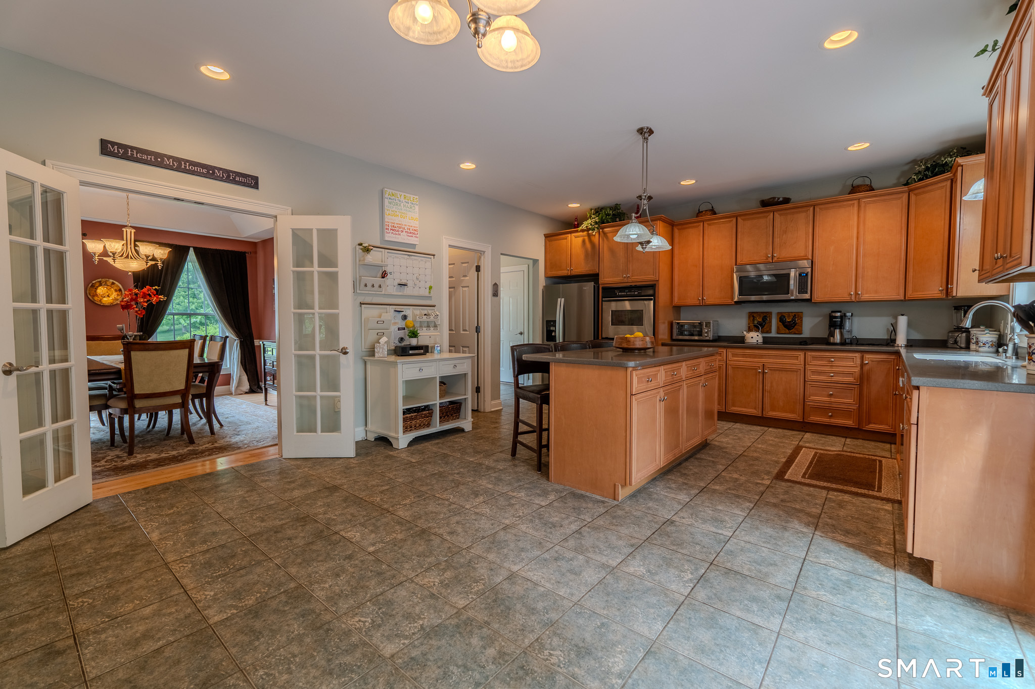 4 Ortense Road Wallingford, CT 06492 - Photo 11 of 33 a kitchen with stainless steel appliances kitchen island granite countertop a stove and cabinets