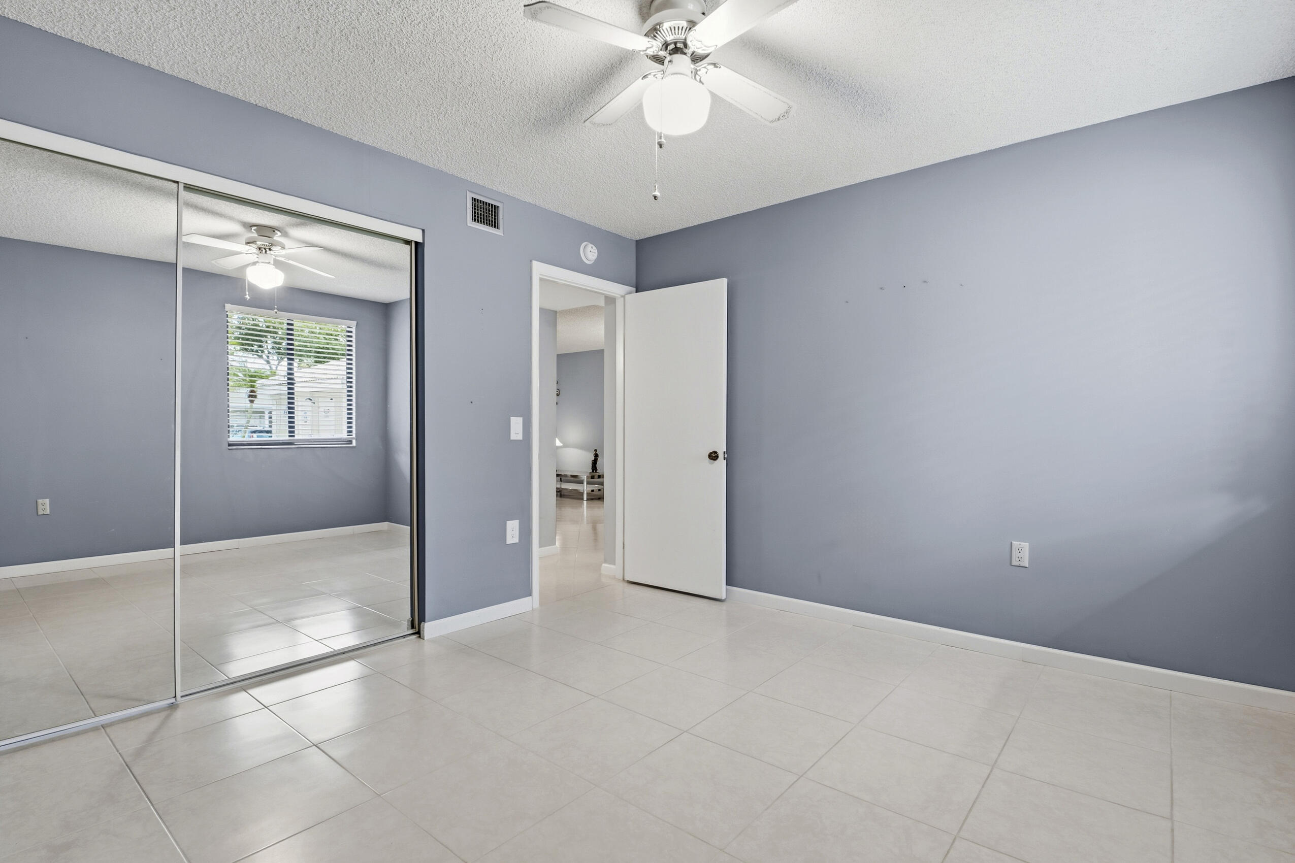 6145 Balboa Circle, Unit 103 Boca Raton, FL 33433 - Photo 20 of 31 a view of an empty room with a window
