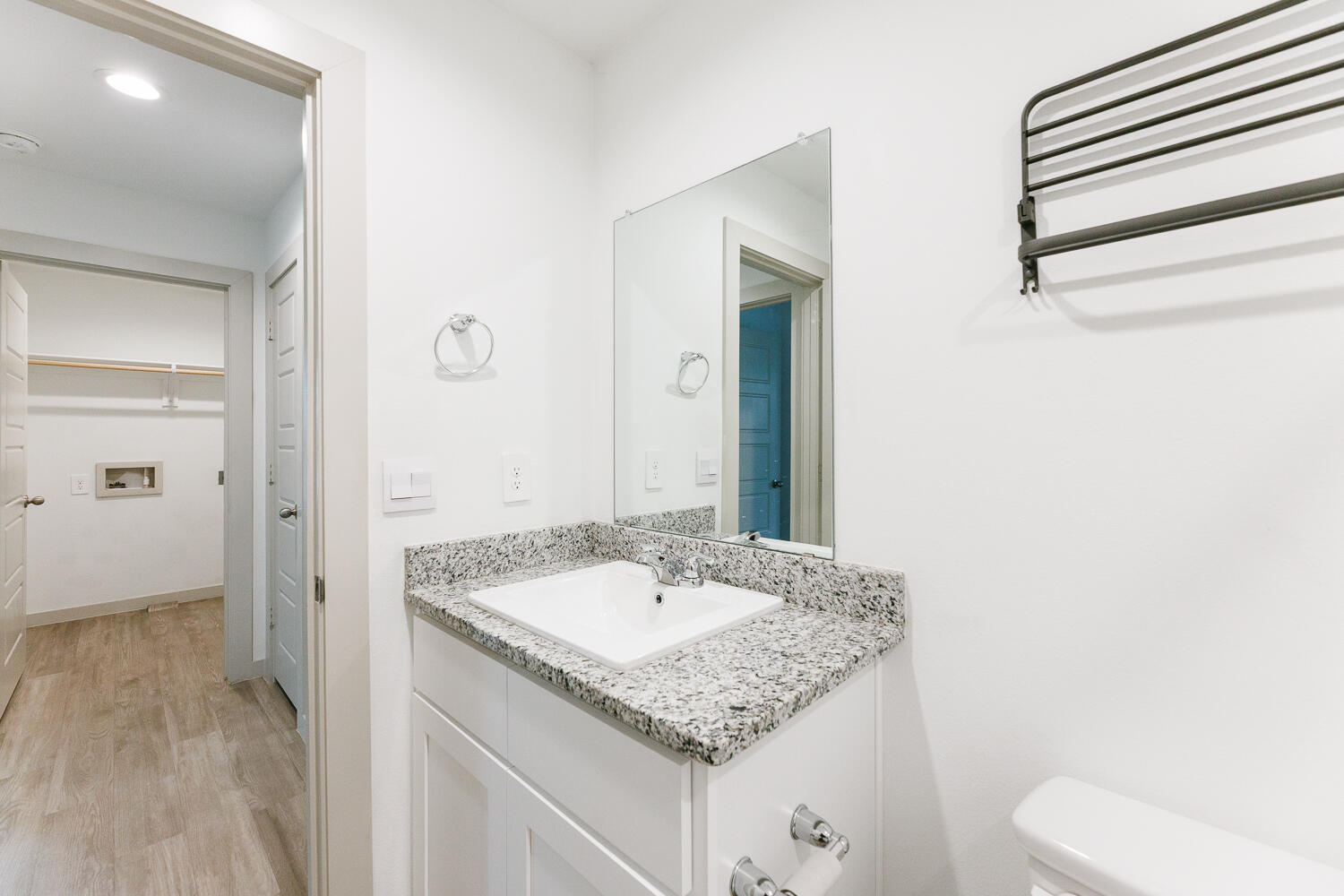 2305 150th Street Lubbock, TX 79423 - Photo 31 of 39 a bathroom with a granite countertop sink and a mirror