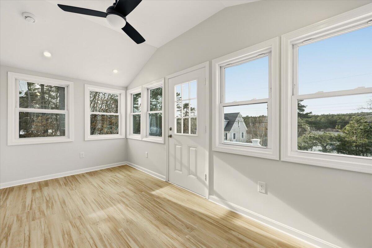 9 Blissful Lane East Wareham, MA 02538 - Photo 28 of 45 a view of an empty room with a window and wooden floor
