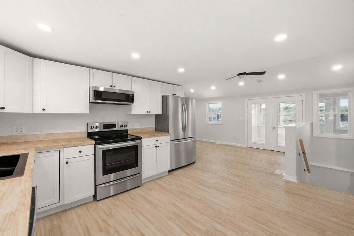 9 Blissful Lane East Wareham, MA 02538 - Photo 8 of 45 a kitchen with stainless steel appliances kitchen island granite countertop a stove a sink and a refrigerator