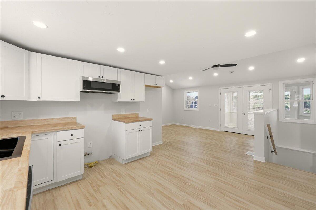 9 Blissful Lane East Wareham, MA 02538 - Photo 9 of 45 a view of kitchen with stainless steel appliances wooden floor sink and wooden floor