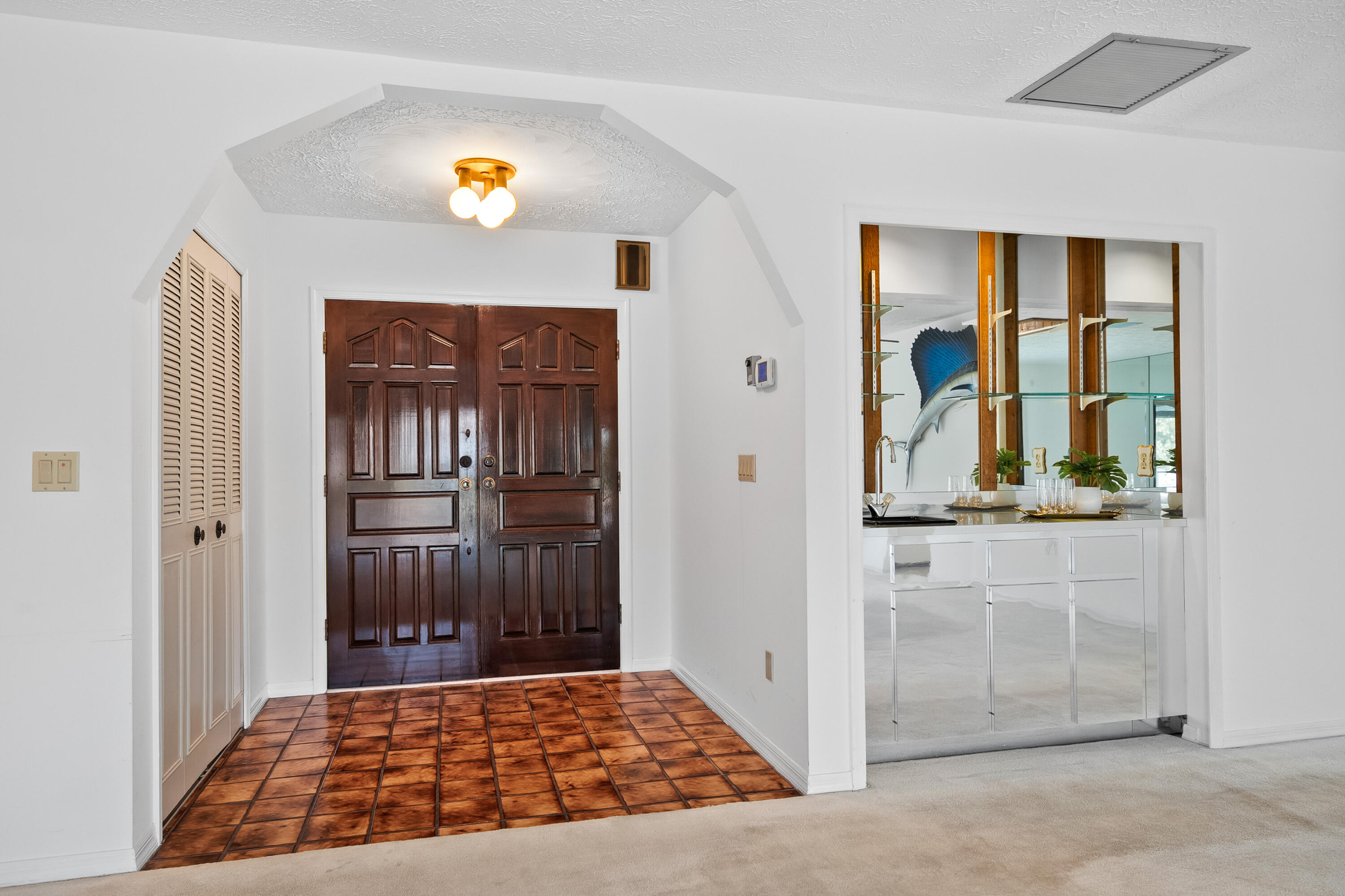 1545 Southwest Dyer Point Road Palm City, FL 34990 - Photo 18 of 44 Beautiful entry hall and wet bar.