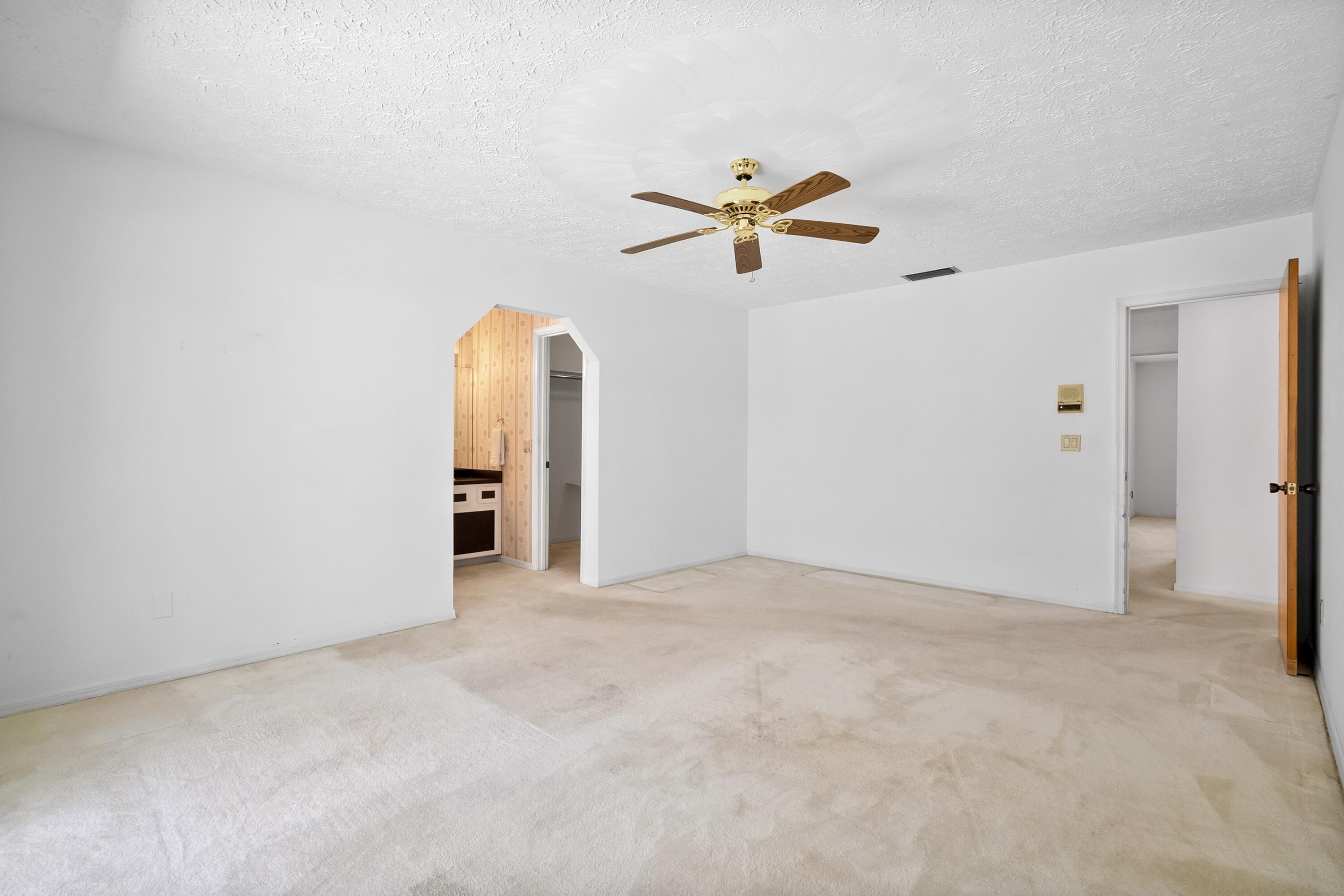 1545 Southwest Dyer Point Road Palm City, FL 34990 - Photo 29 of 44 Primary Suite
