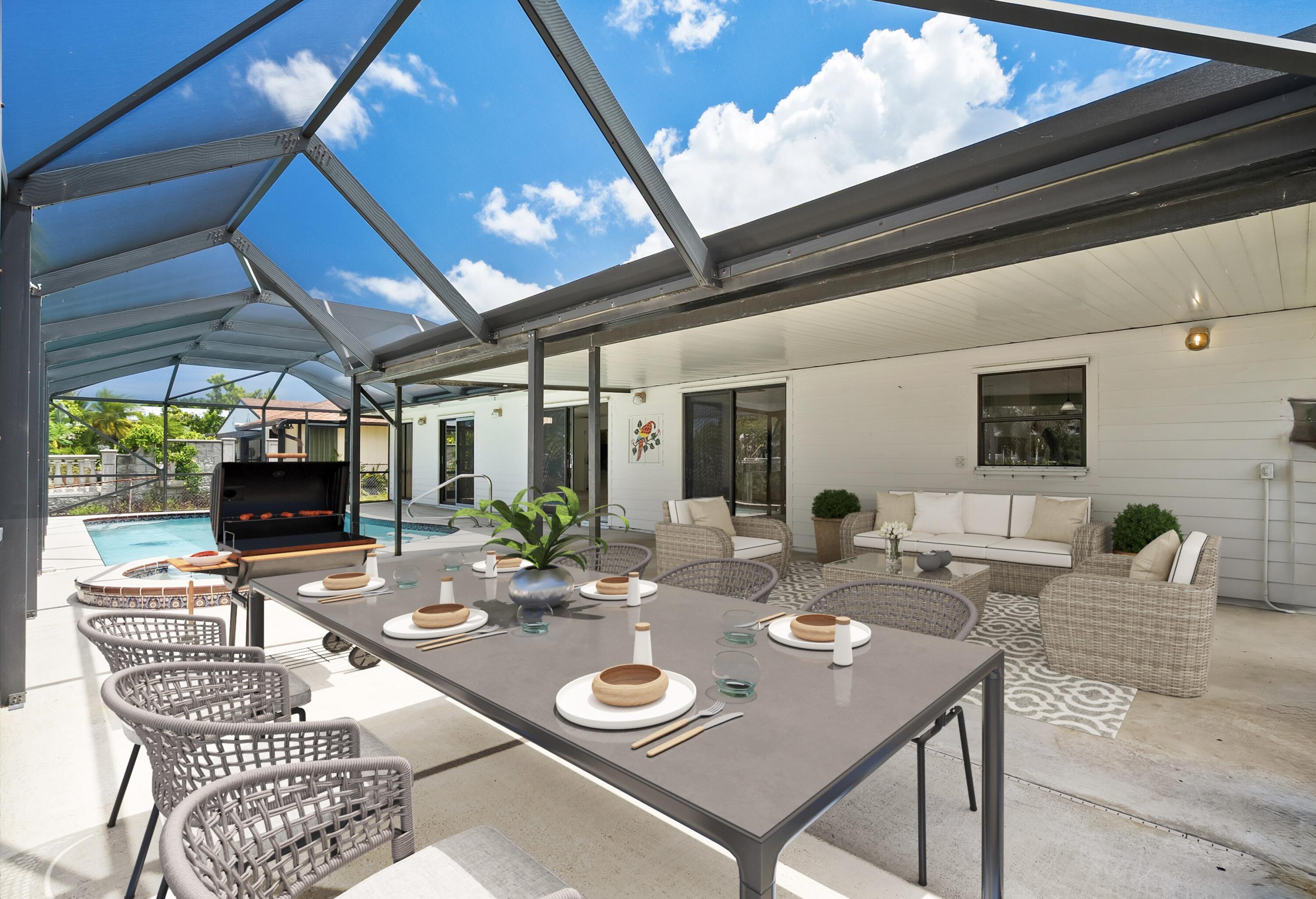 1545 Southwest Dyer Point Road Palm City, FL 34990 - Photo 36 of 44 Entertain by the pool-staged.
