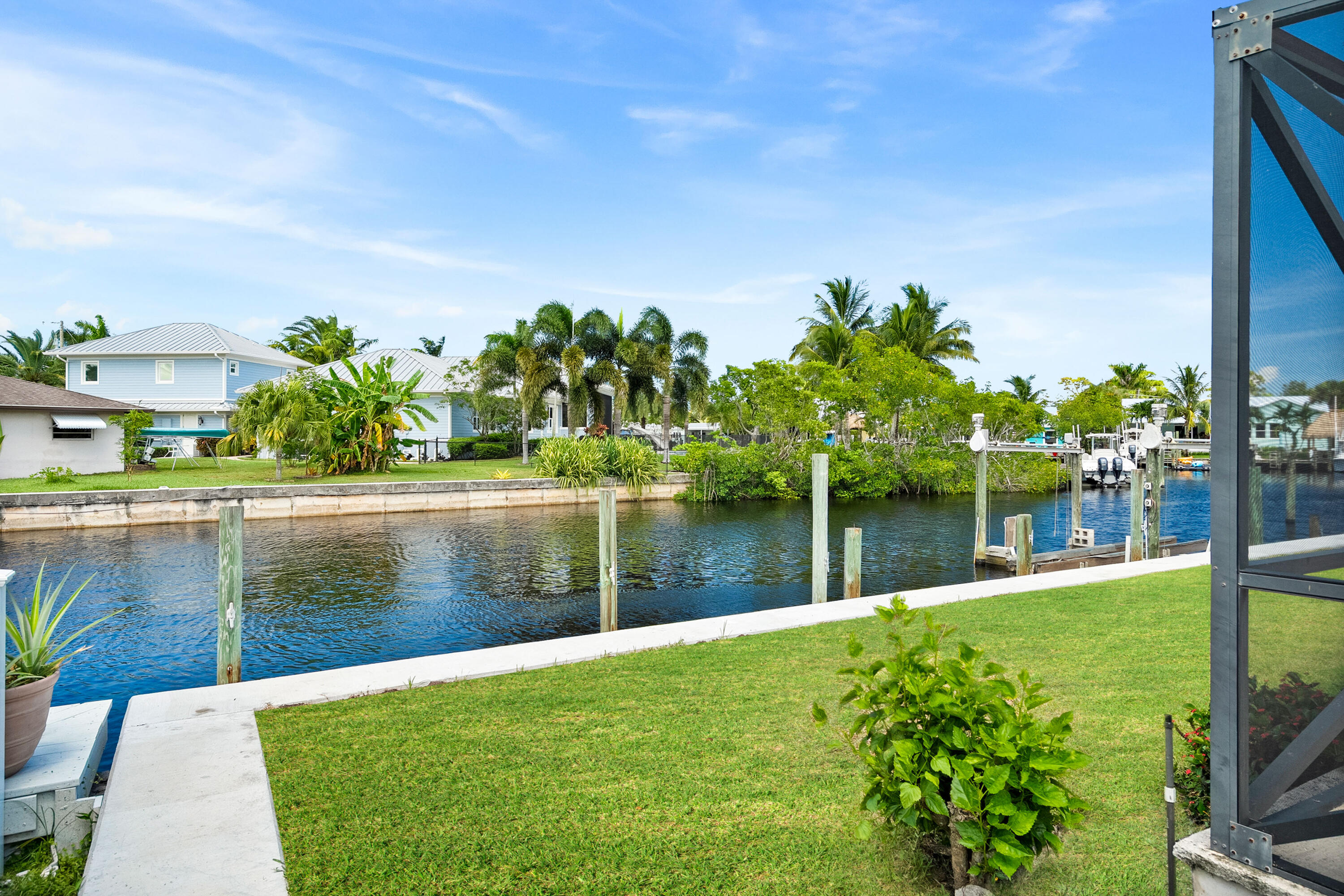 1545 Southwest Dyer Point Road Palm City, FL 34990 - Photo 38 of 44 Backyard/New Seawall