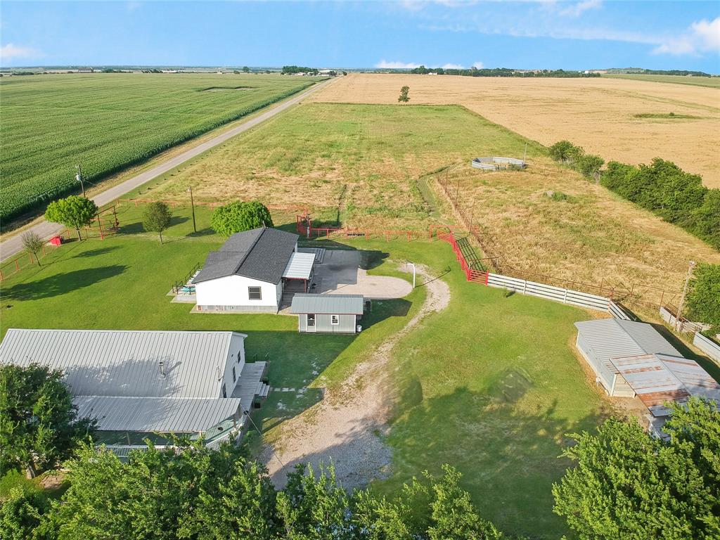 455 Hughes Cemetery Road Italy, TX 76651 - Photo 1 of 40 an aerial view of ocean with residential house and outdoor space