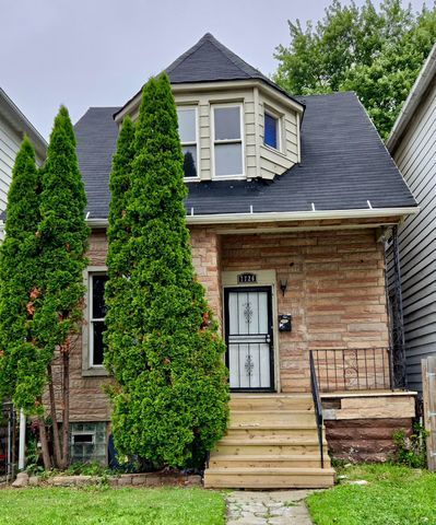 7726 South Maryland Avenue Chicago, IL 60619 - Photo 1 of 17 a front view of a house with a yard