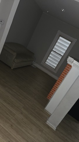 7726 South Maryland Avenue Chicago, IL 60619 - Photo 15 of 17 a view of an empty room with wooden floor