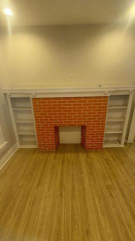 7726 South Maryland Avenue Chicago, IL 60619 - Photo 5 of 17 a view of wooden floor with a sink