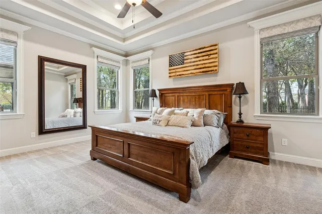 a bed room with a bed and a large window