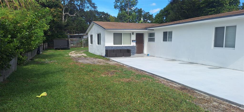 1555 Northeast 148th Street Miami, FL 33161 - Photo 14 of 14 a view of backyard of house with green space