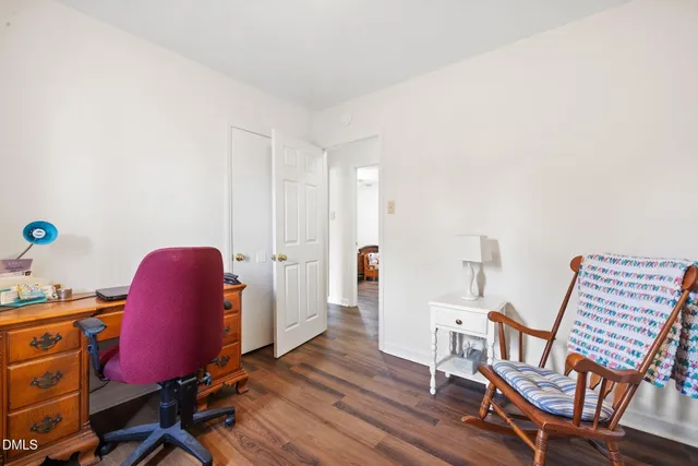 a workspace with furniture and wooden floor