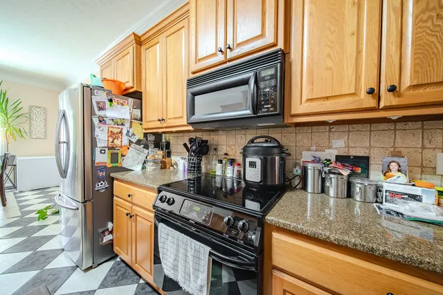a dining room with furniture a rug and a chandelier