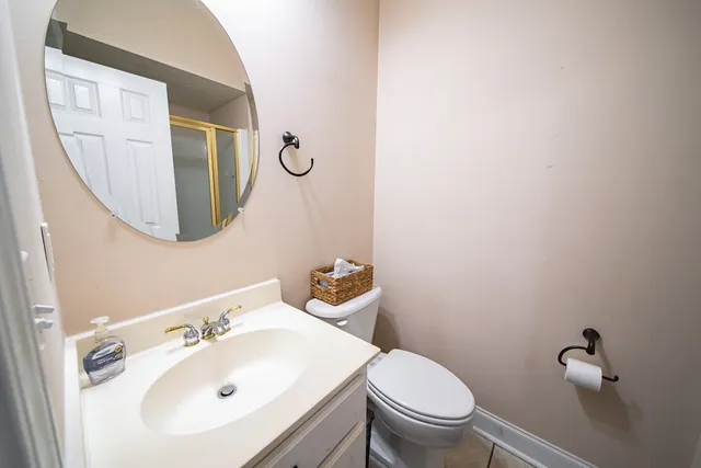 a bed room with a bed and a chandelier