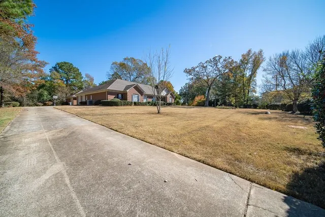 a view of house with yard and street view